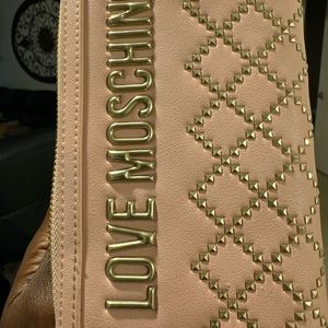 Love Moschino wallet New it only has one small pin mark on front